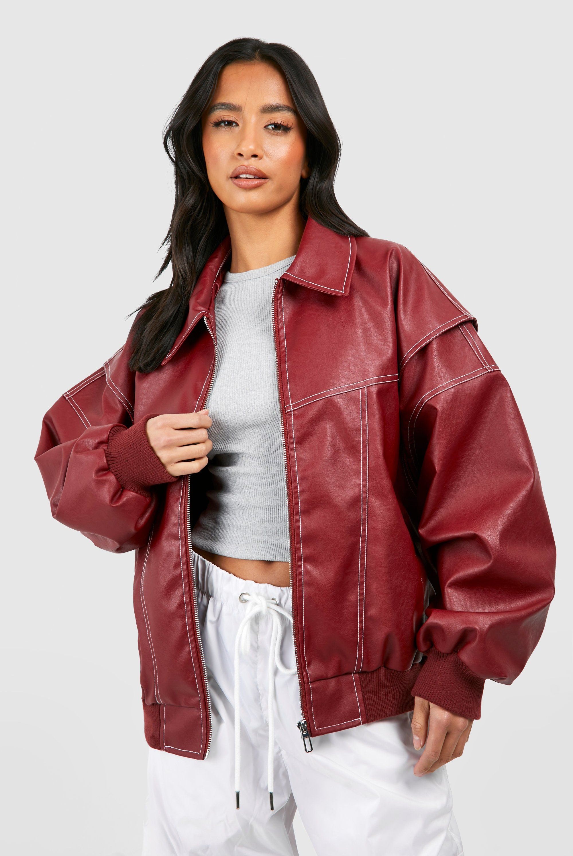 Isabella oversized black vegan leather bomber jacket with ribbed cuffs by Lumina Wear, styled for a trendy casual look.