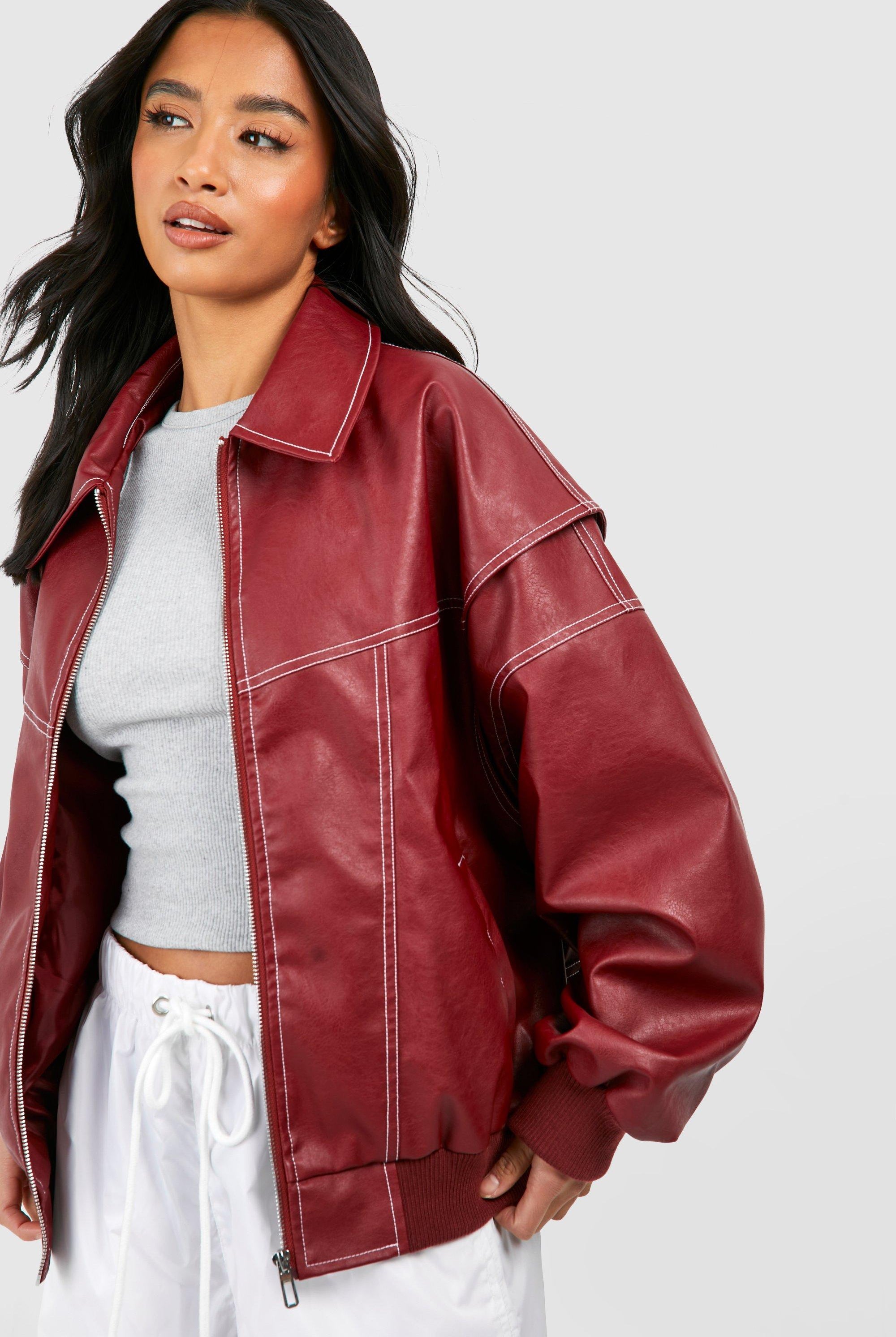 Black vegan leather oversized bomber jacket with ribbed cuffs from Lumina Wear, featuring a stylish and modern design.