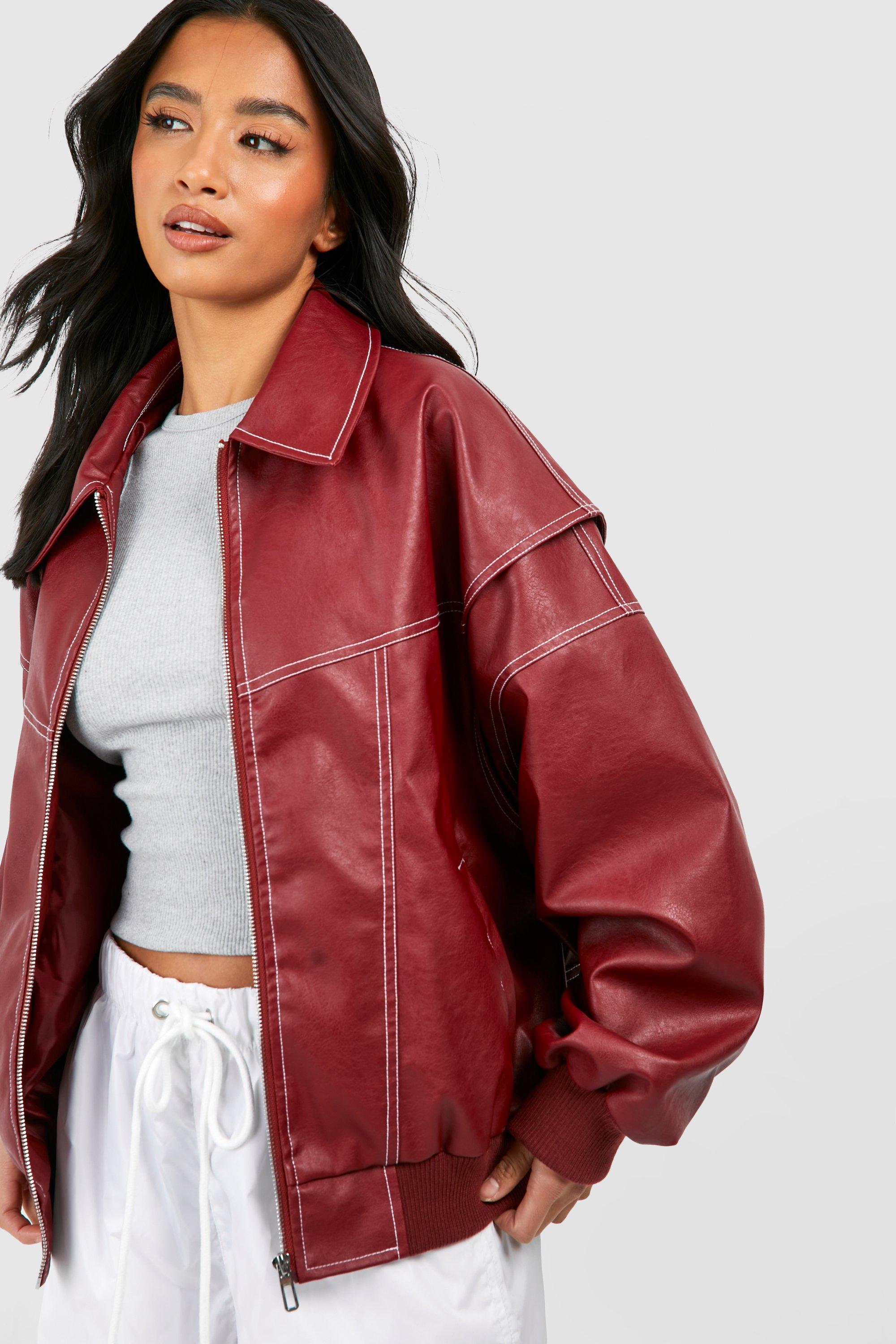 Black vegan leather oversized bomber jacket with ribbed cuffs from Lumina Wear, featuring a stylish and modern design.