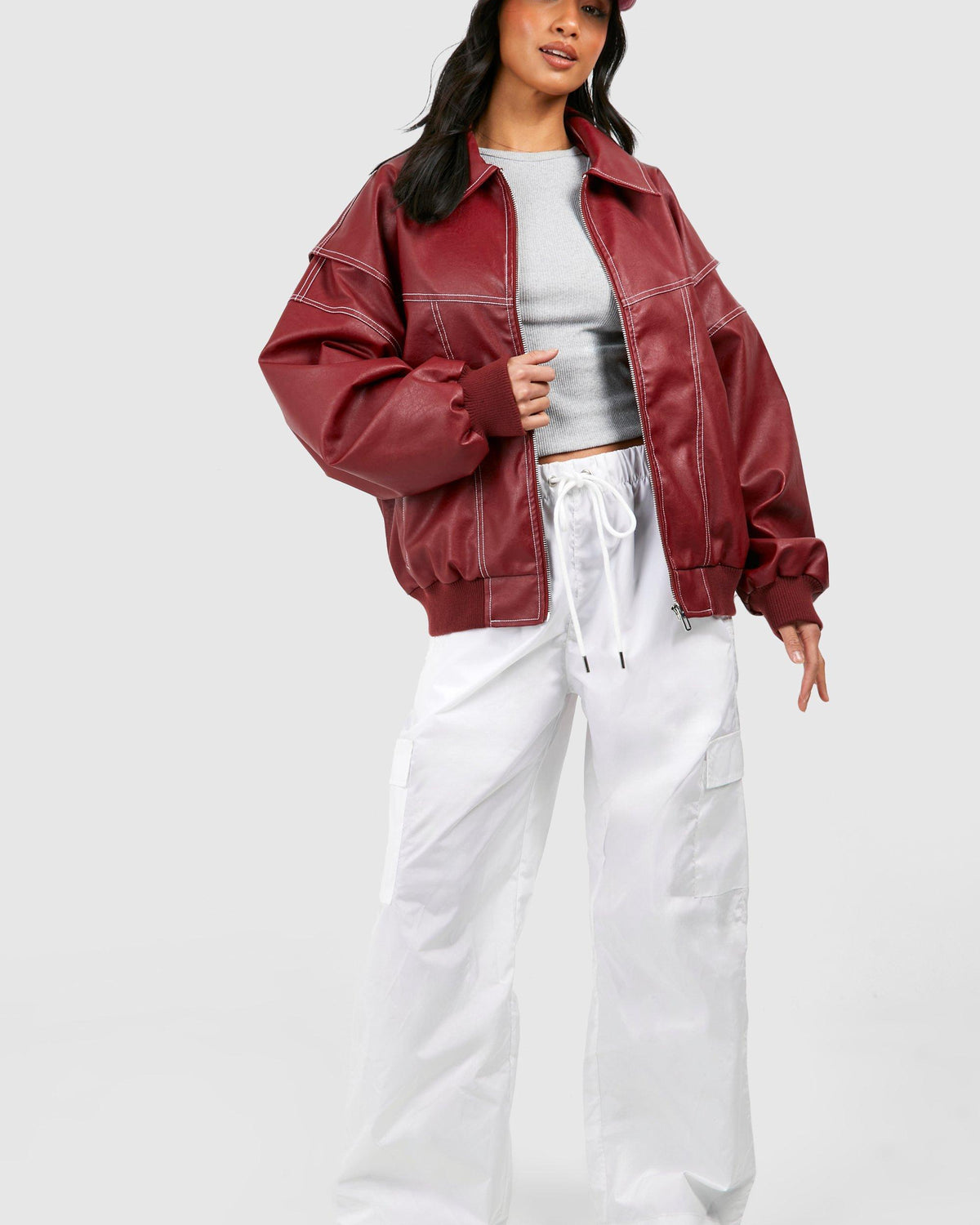 Black vegan leather bomber jacket with oversized fit and ribbed cuffs from Lumina Wear's Isabella collection.
