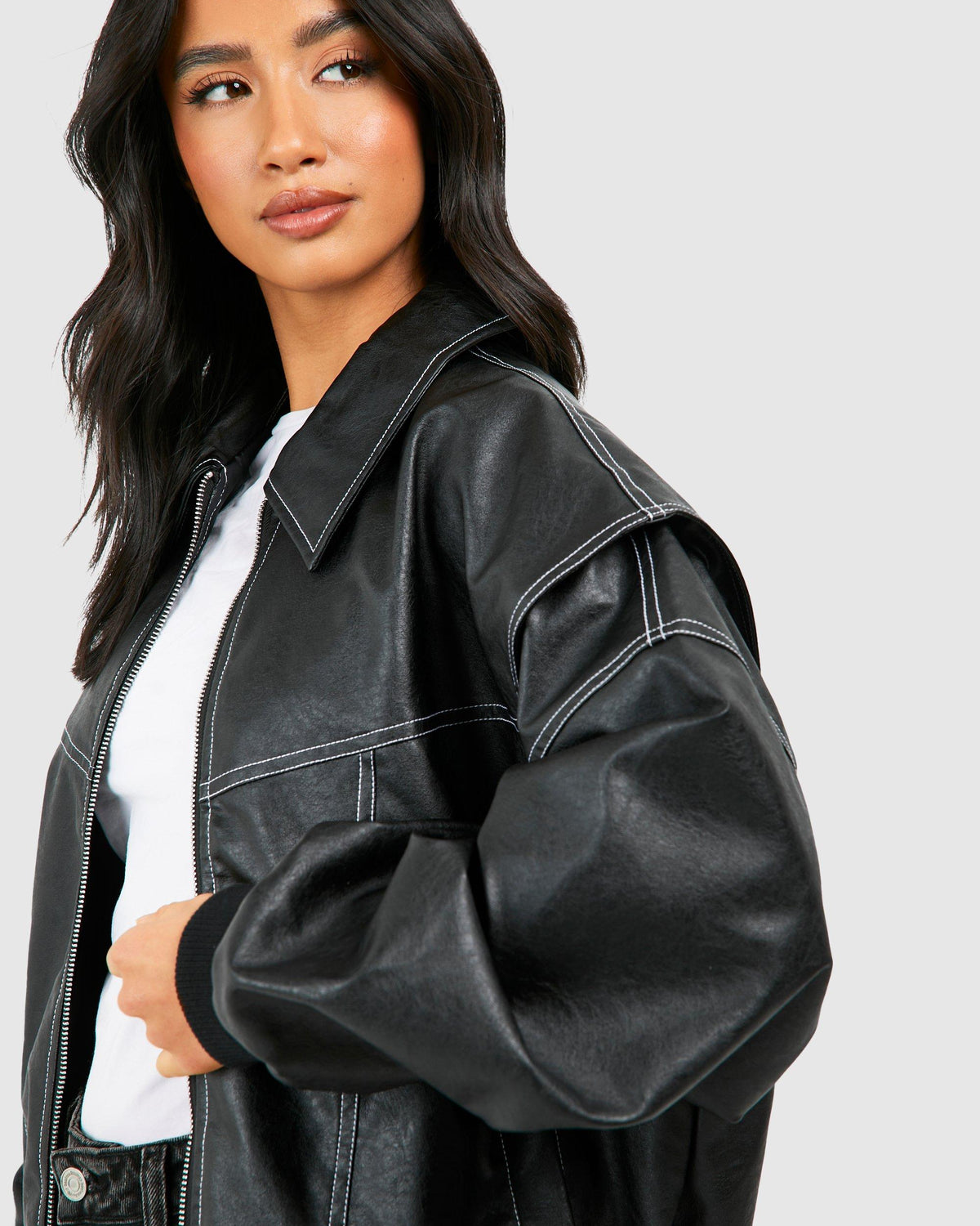 Isabella oversized black vegan leather bomber jacket by Lumina Wear with ribbed cuffs, stylish and trendy outerwear for women.