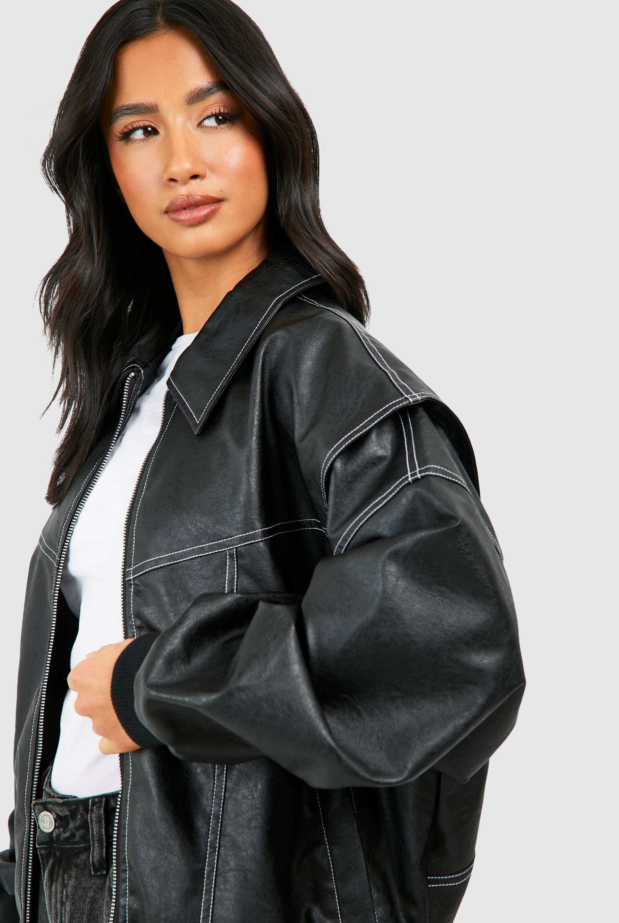 Isabella oversized black vegan leather bomber jacket with ribbed cuffs by Lumina Wear, displayed on a hanger.