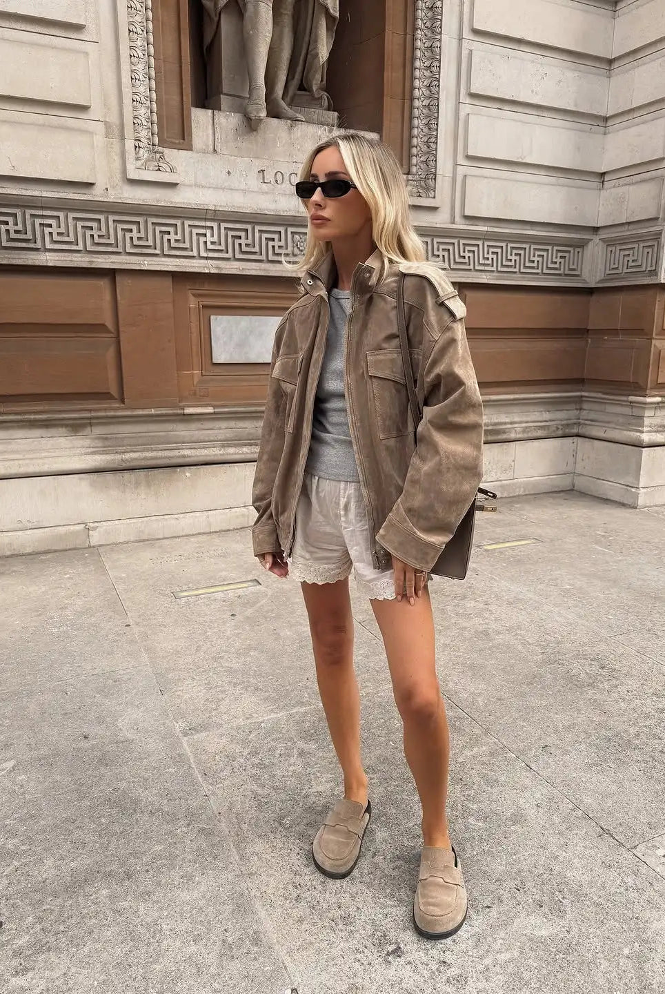 Isabella wearing the Lumina Wear Anouk oversized boxy fit utility jacket with stand collar, in a casual outdoor setting.