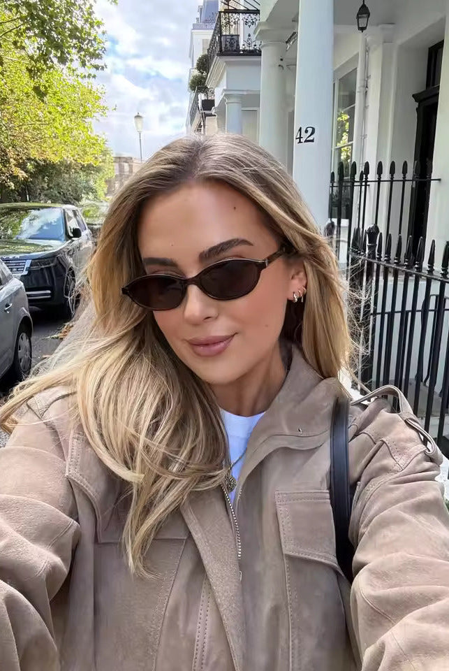 Isabella wearing the Lumina Wear Anouk oversized boxy fit utility jacket with stand collar, in a casual outdoor setting.