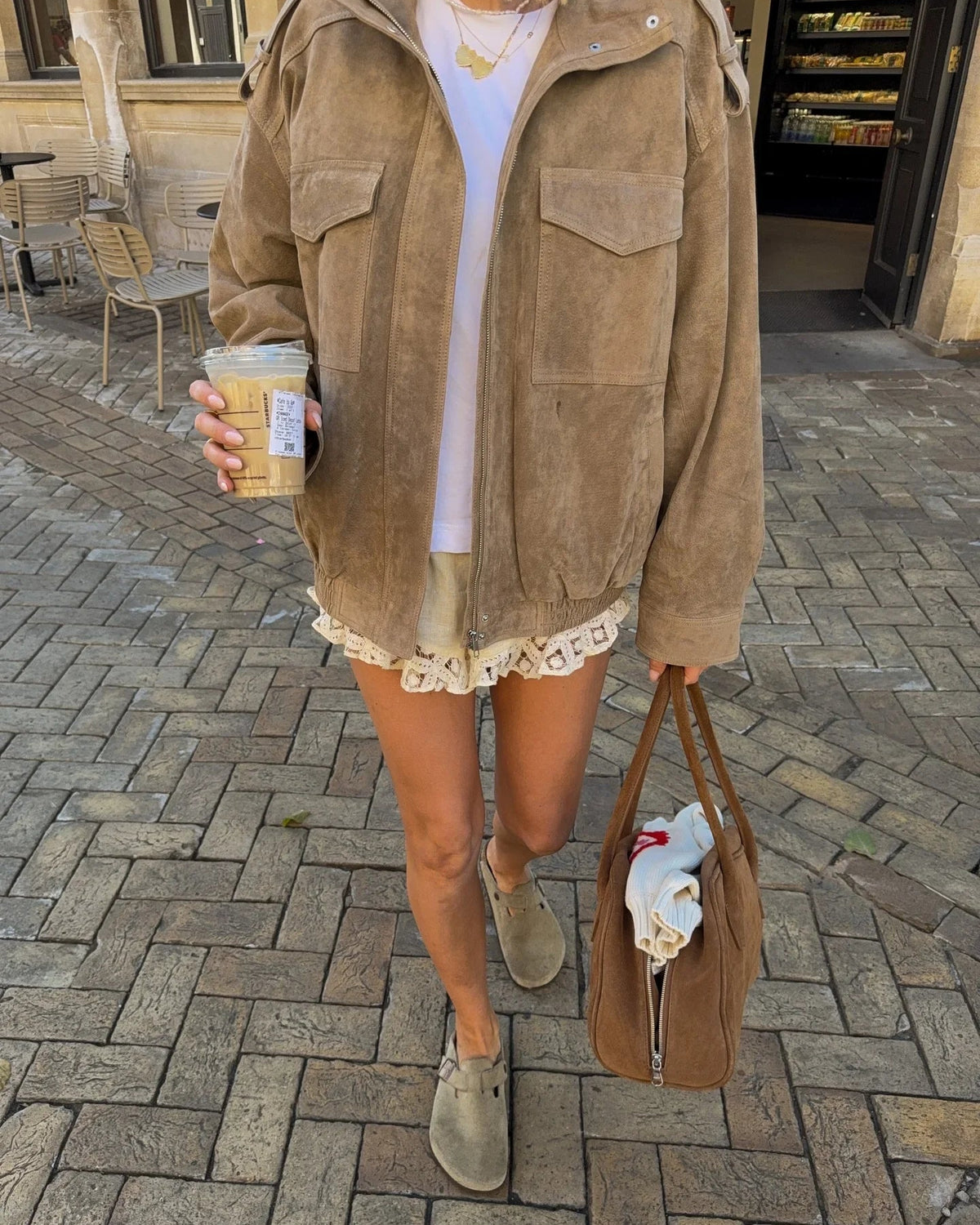 Light gray oversized boxy utility jacket with flap pockets from Lumina Wear's Isabella collection, shown on a hanger.