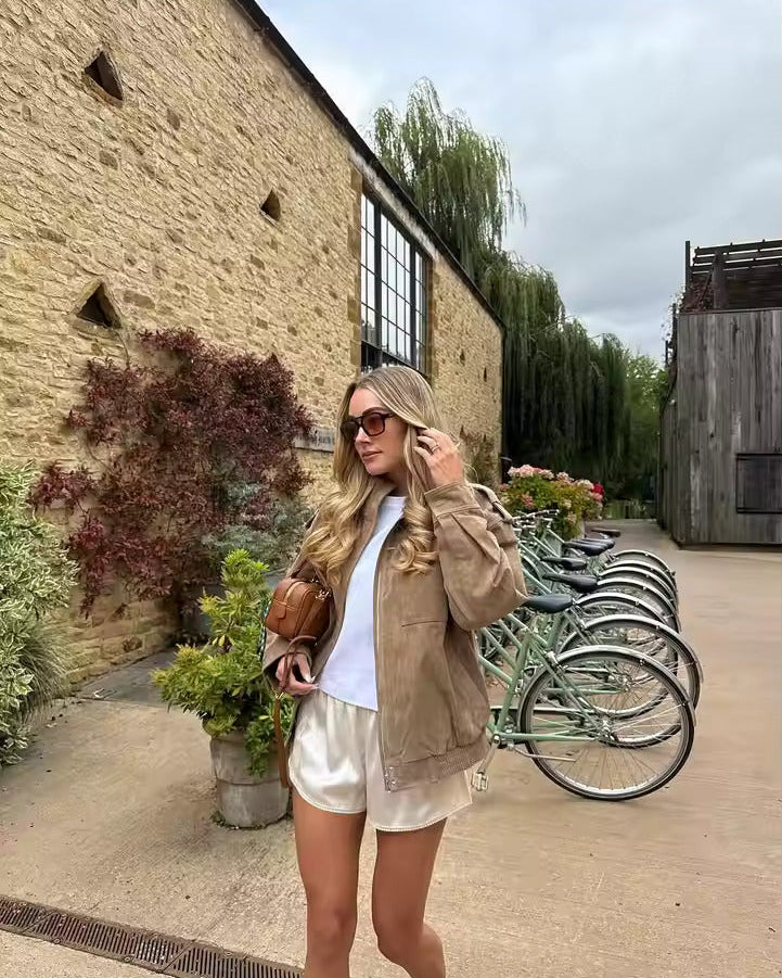 Lumina Wear Isabella oversized boxy utility jacket with flap pockets, shown in a casual outdoor setting.