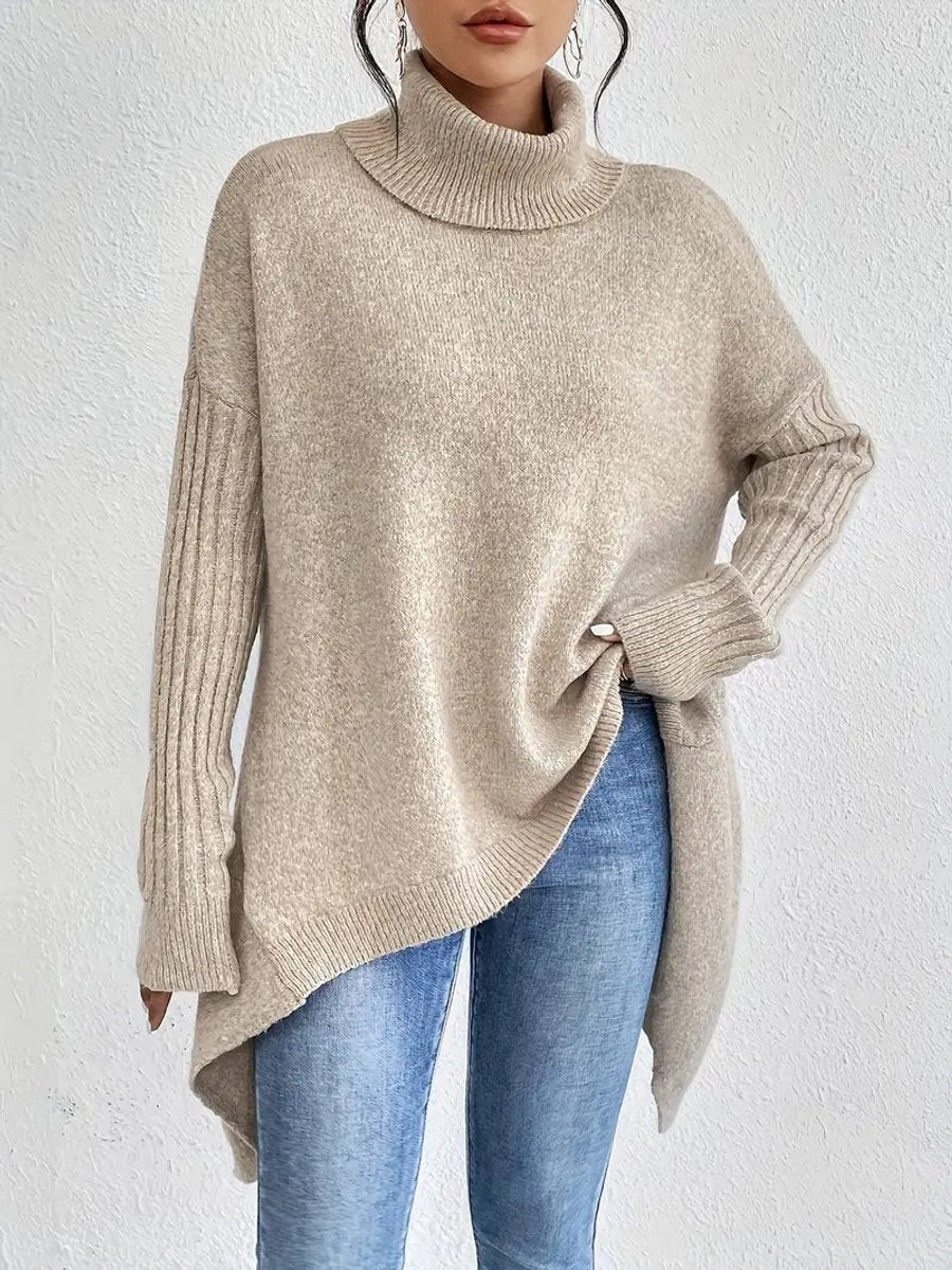 Lumina Wear Isabella oversized ribbed turtleneck sweater with longline fit, styled on a woman, in a cozy neutral tone.