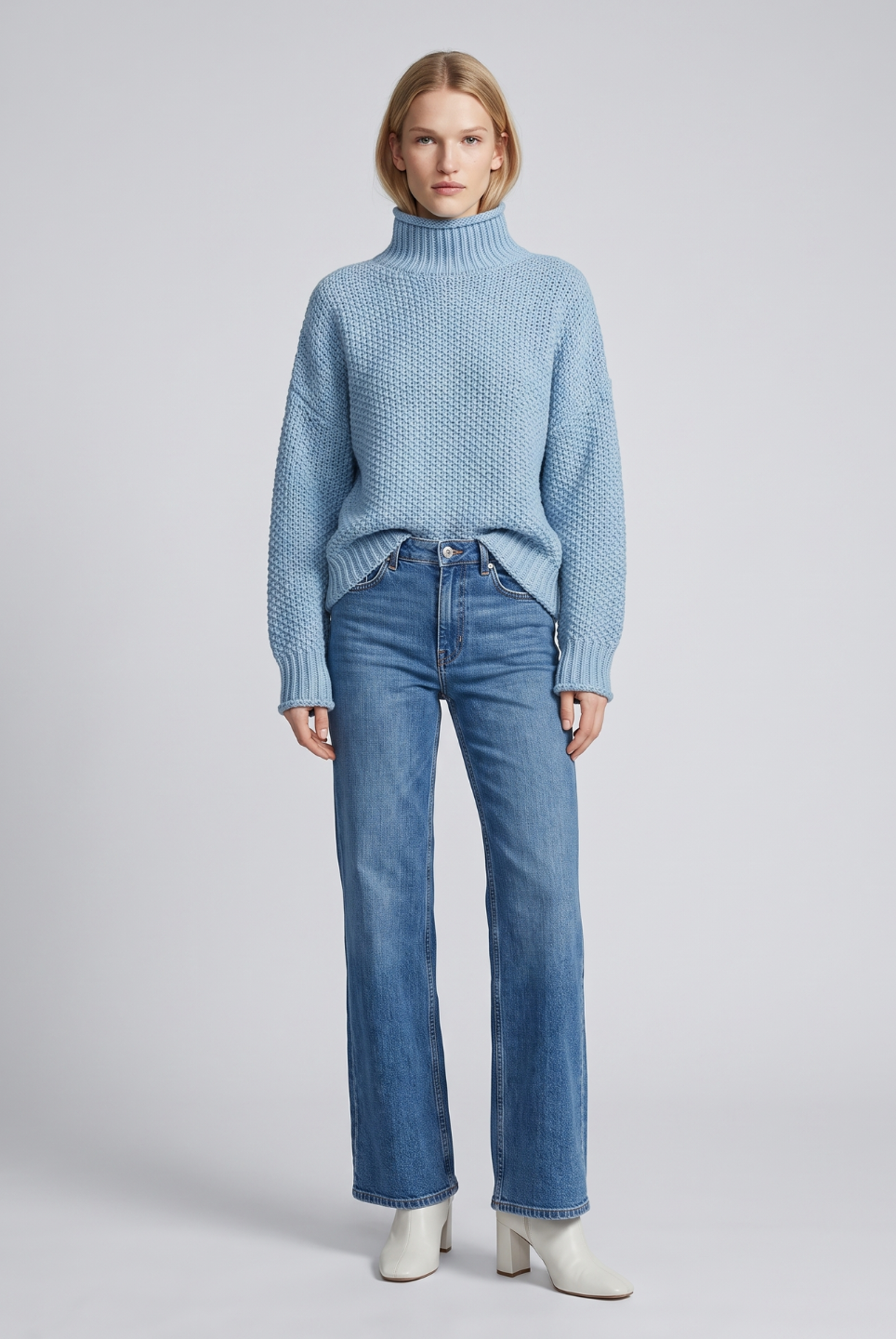 Isabella Lumina Wear oversized textured waffle-knit turtleneck sweater in beige, showcasing cozy knit fabric and relaxed fit.