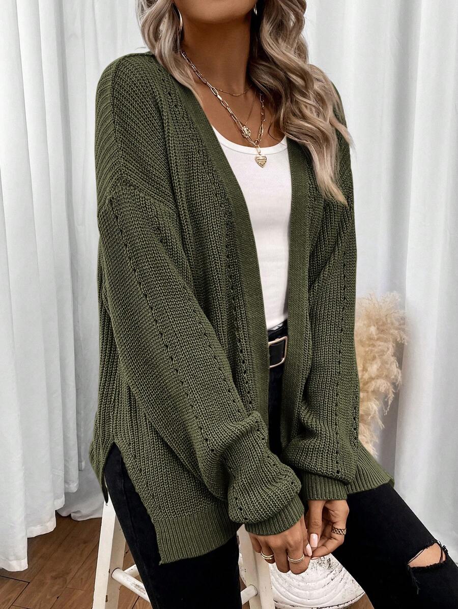 Black pointelle knit women's cardigan sweater with side split hem from Lumina Wear's Isabella collection.