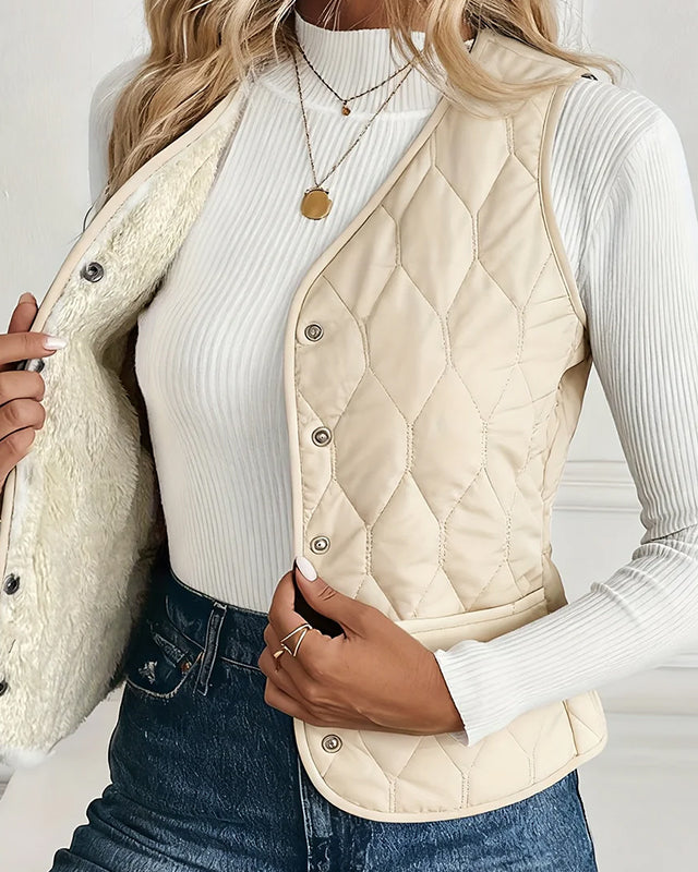 Lumina Wear Isabella quilted snap-front vest with cozy sherpa lining, stylish and warm outerwear for cold weather.