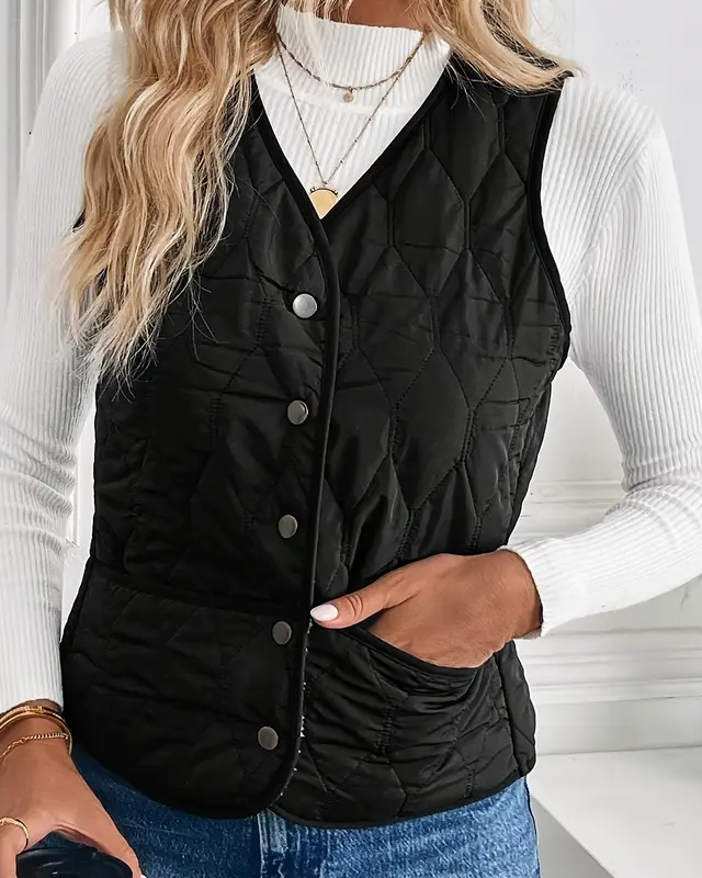 Lumina Wear Isabella quilted snap-front vest with Sherpa lining, showcasing a stylish, warm outer layer with a cozy interior.