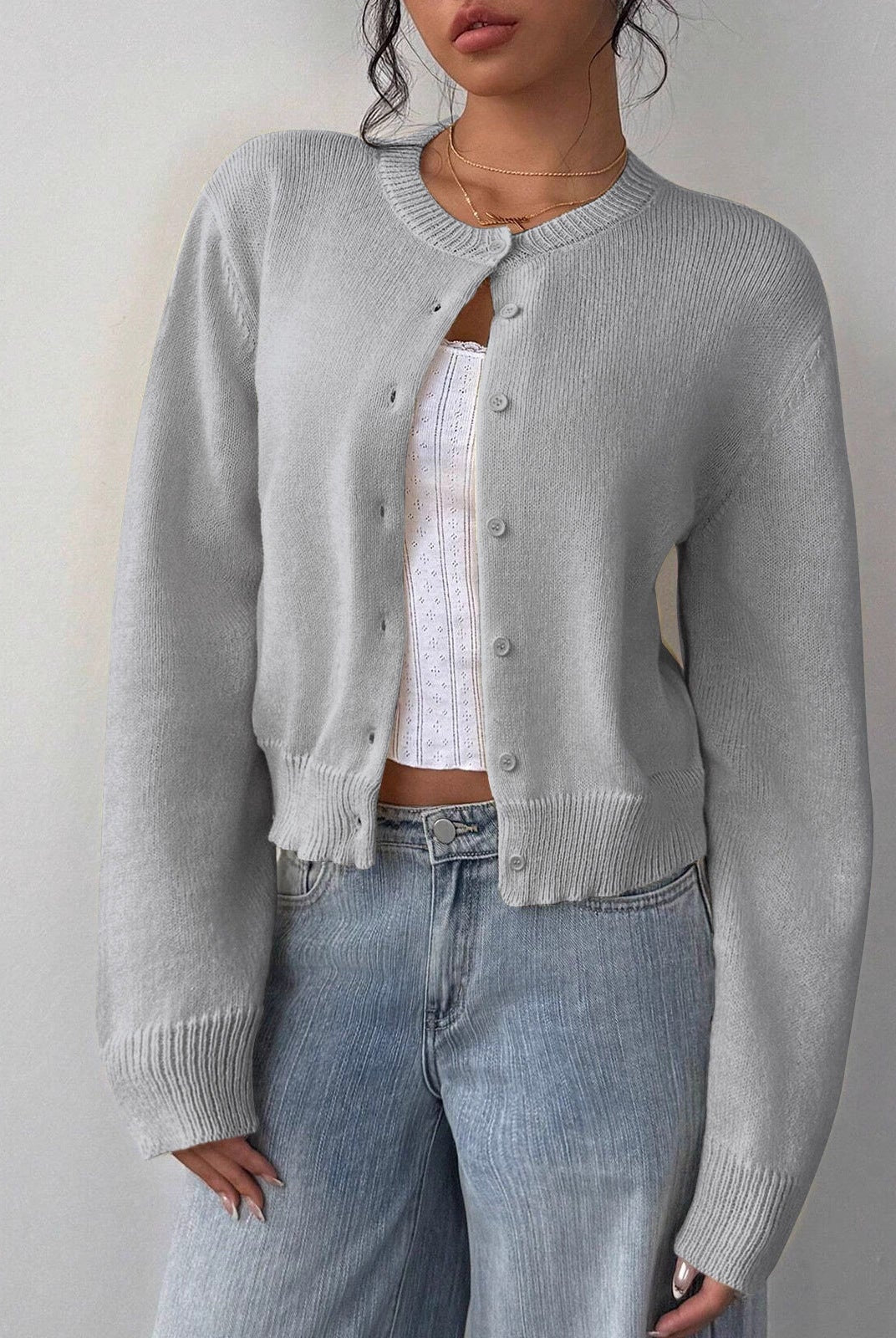 Relaxed cropped white cardigan sweater with ribbed trim by Lumina Wear, displayed on a mannequin.