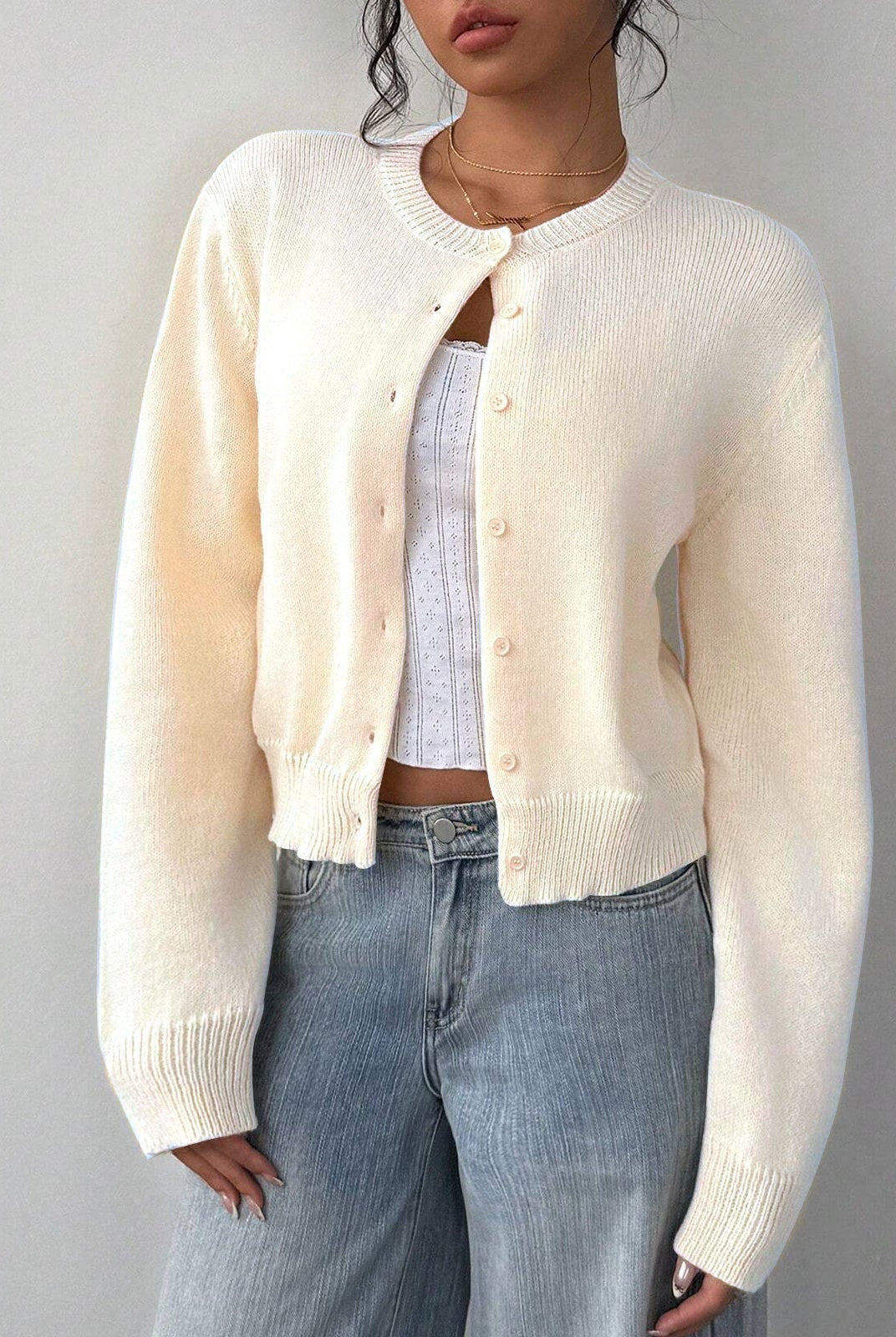 Relaxed cropped white cardigan sweater with ribbed trim from Lumina Wear, featuring a casual fit and soft knit fabric.