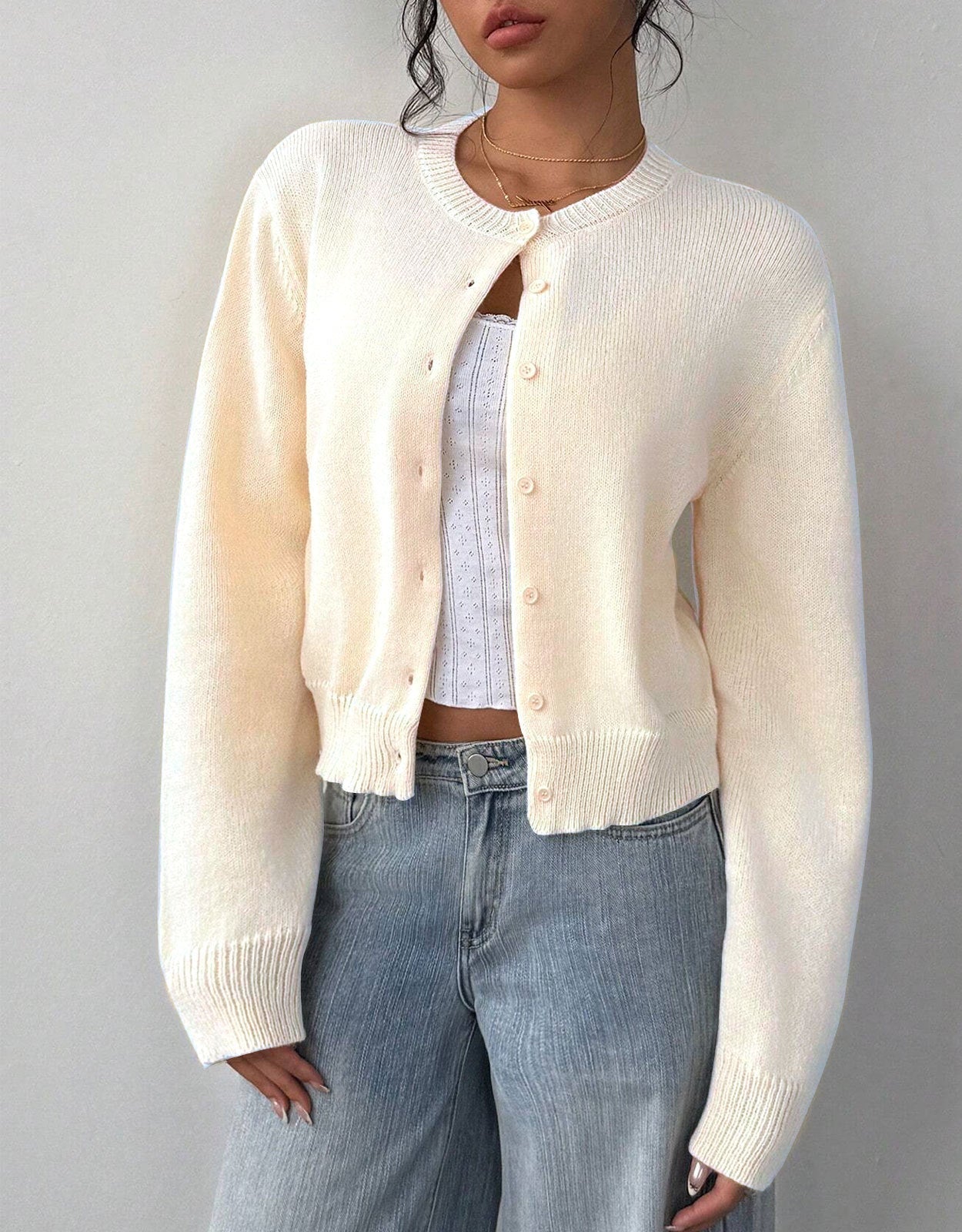 Relaxed white cropped cardigan sweater with ribbed trim from Lumina Wear, featuring a soft knit fabric and stylish fit.