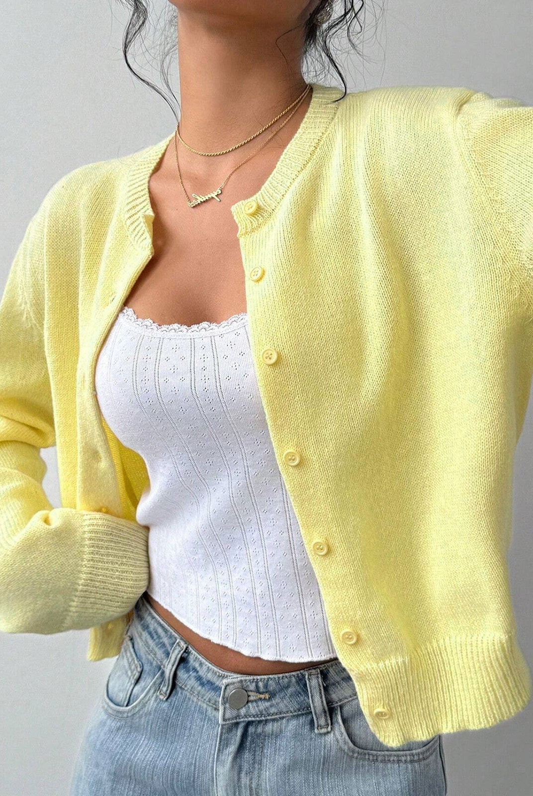 White cropped cardigan sweater with ribbed trim from Lumina Wear, featuring a relaxed fit and stylish design.