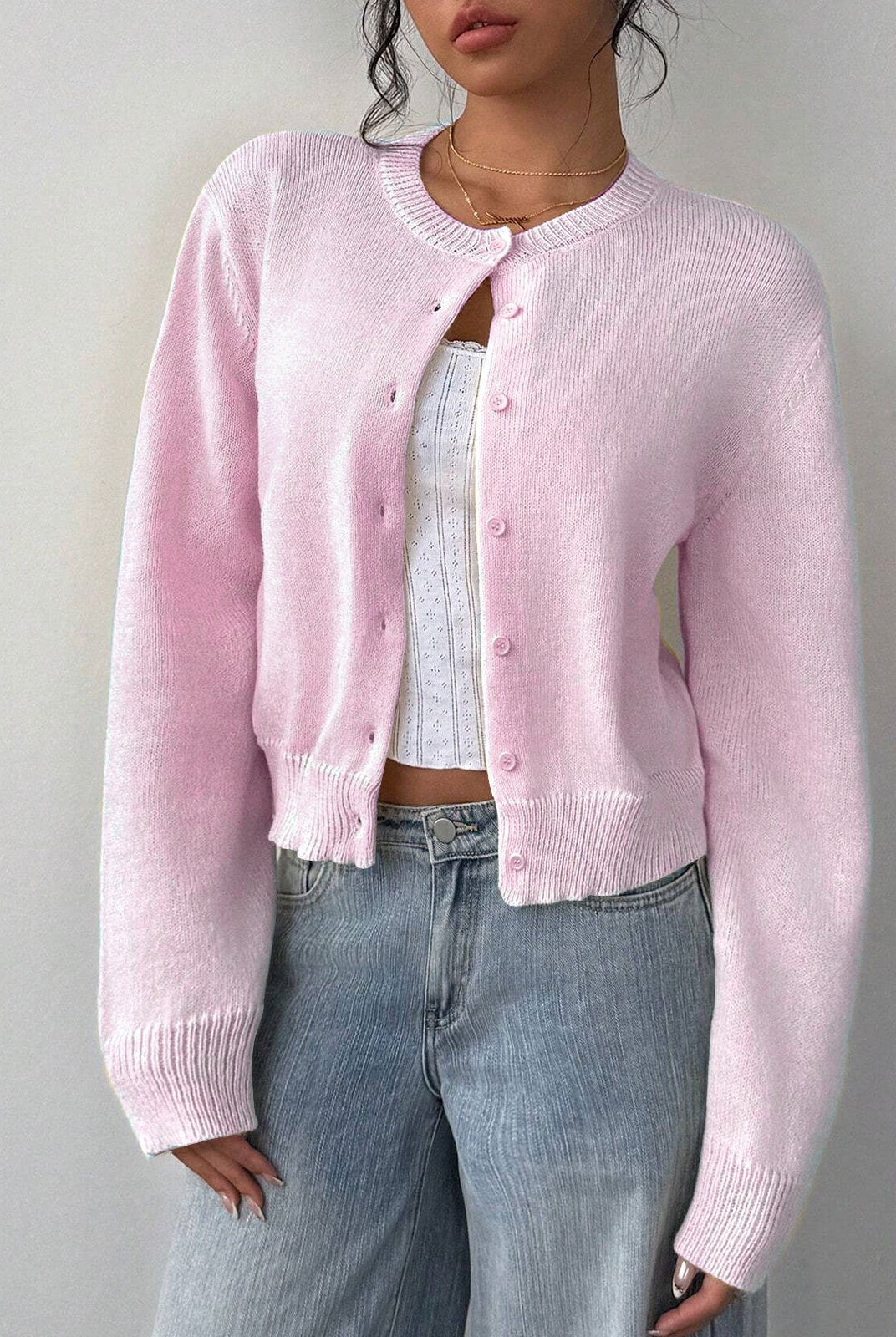 Relaxed white cropped cardigan sweater with ribbed trim from Lumina Wear, styled casually with long sleeves and open front.