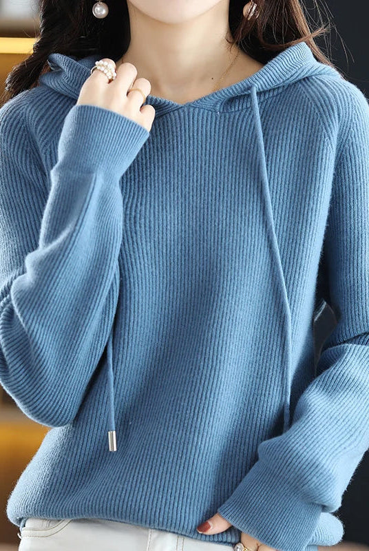 Lumina Wear Isabella relaxed hooded knit sweater with soft textured fabric, shown on a model. Perfect for cozy casual wear.