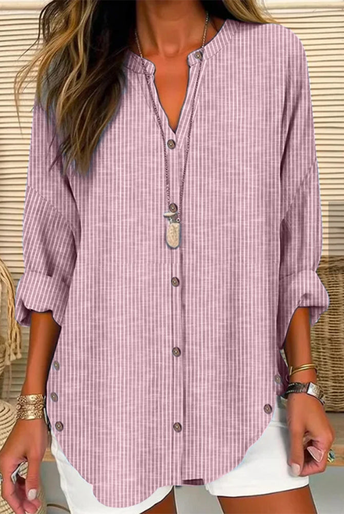 Light blue and white striped Lumina Wear Isabella relaxed blouse with button front and long sleeves, casual and stylish for everyday wear.