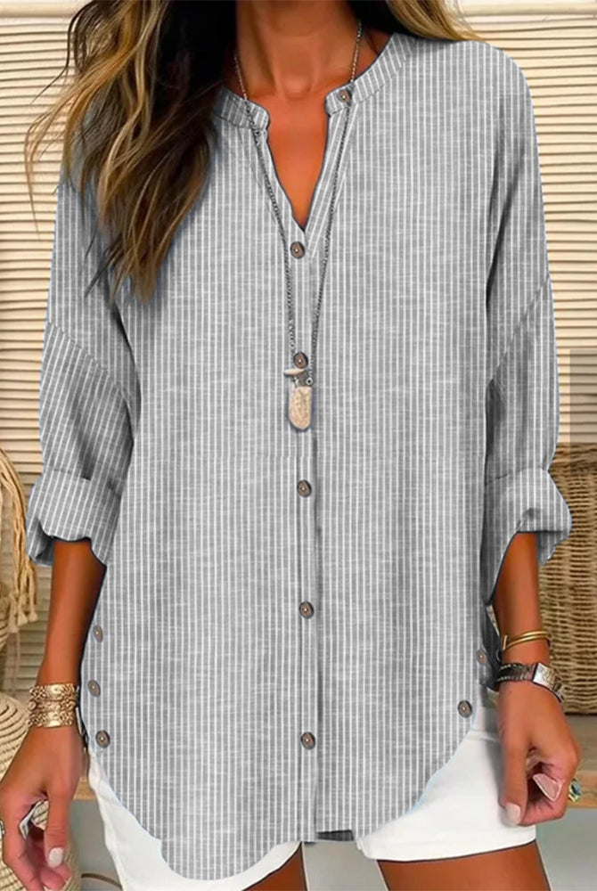Isabella Lumina relaxed striped blouse with button front, featuring casual fit and lightweight fabric, displayed on a hanger.