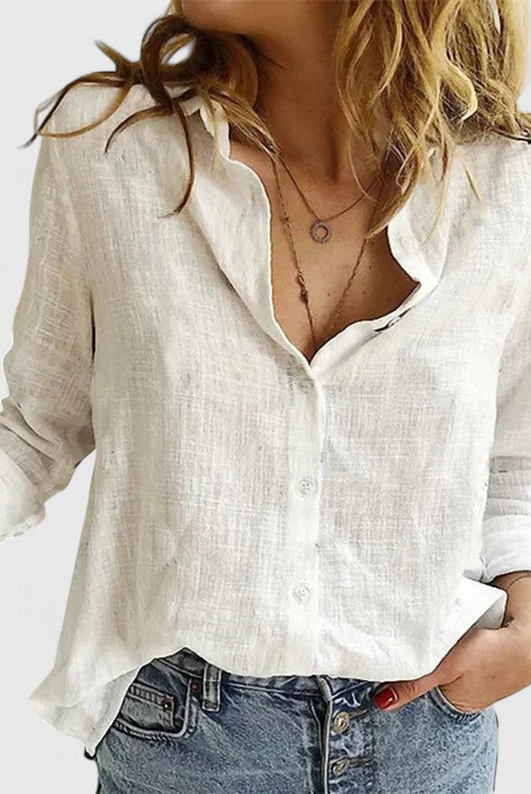 Light blue Isabella Lumina Wear relaxed V-neck blouse with button front, featuring a soft, flowing fabric and casual fit.