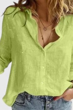 Light beige Isabella relaxed V-neck blouse with button front from Lumina Wear, shown on a hanger.