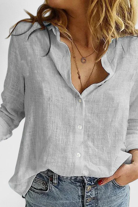 Light blue Isabella Lumina Wear relaxed v-neck blouse with button front, shown on a model. Casual, stylish women's blouse.