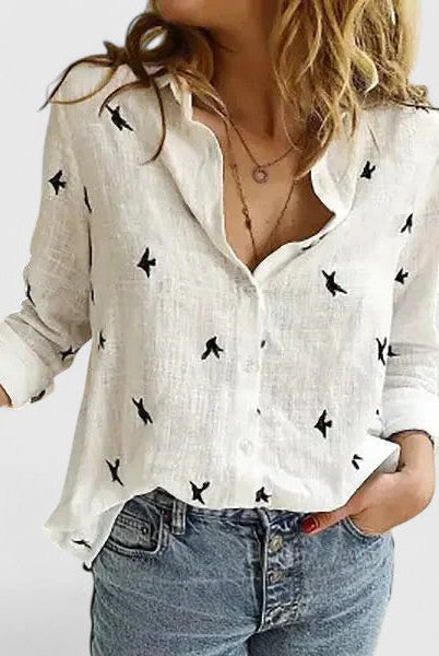 Light beige Isabella Lumina Wear relaxed V-neck blouse with button front, casual style, and long sleeves.