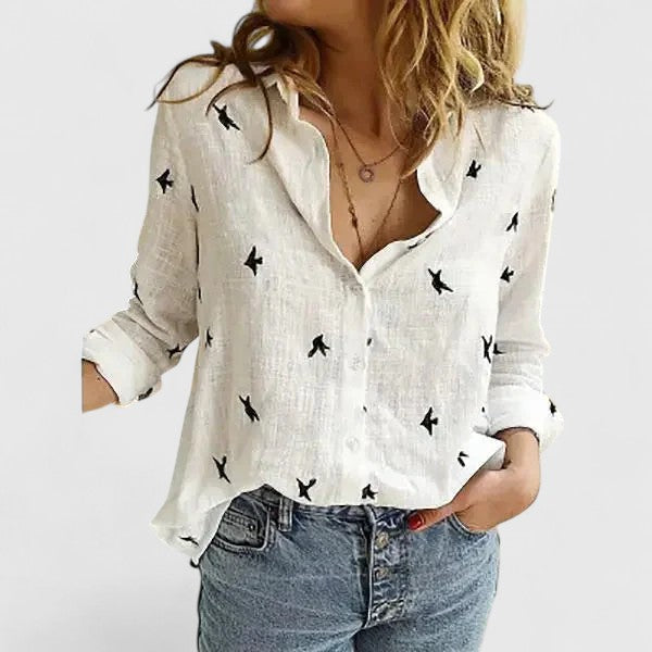 Light beige Isabella Lumina Wear relaxed V-neck blouse with button front, casual style, and long sleeves.