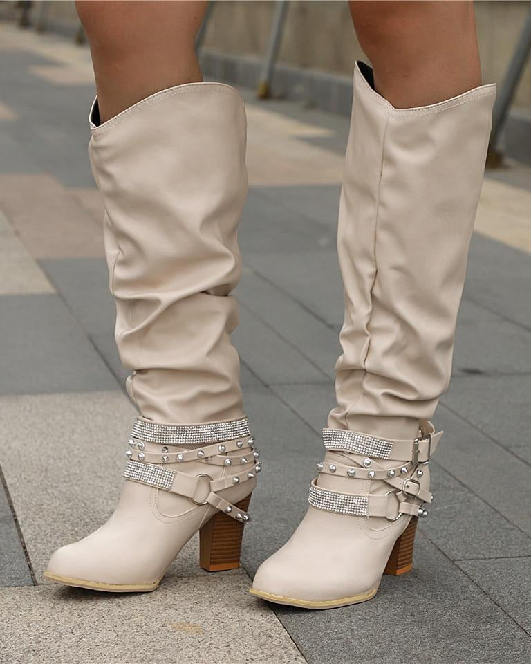 Lumina Wear Isabella studded strap slouch knee-high boots with block heel, showcasing a fashionable design and textured details.