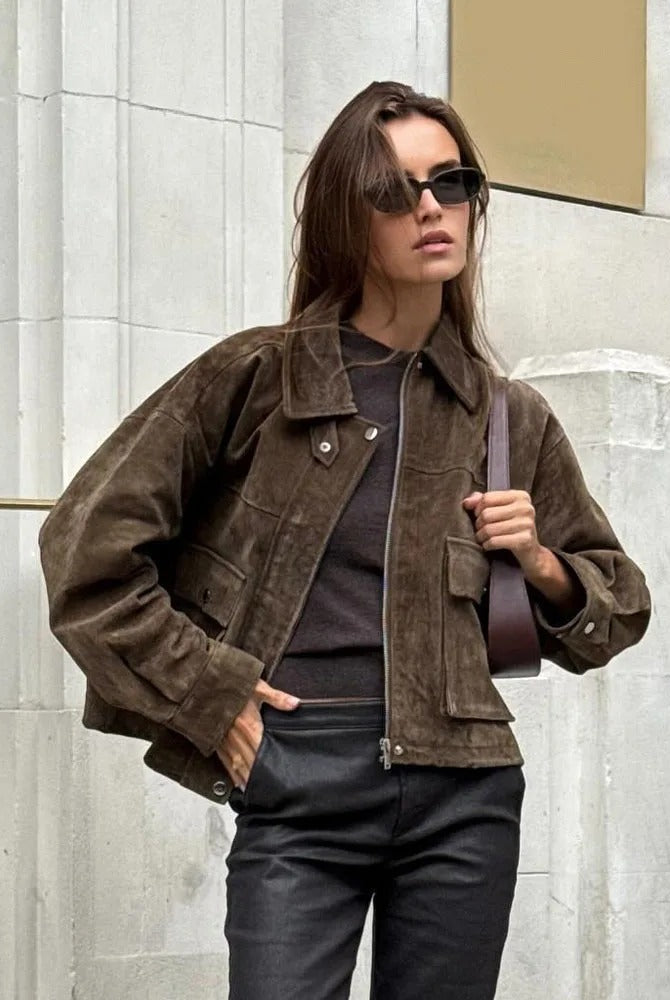 Isabella wearing Lumina Wear Rosalind suede utility jacket with flap pockets and zip front, stylish and versatile outerwear.