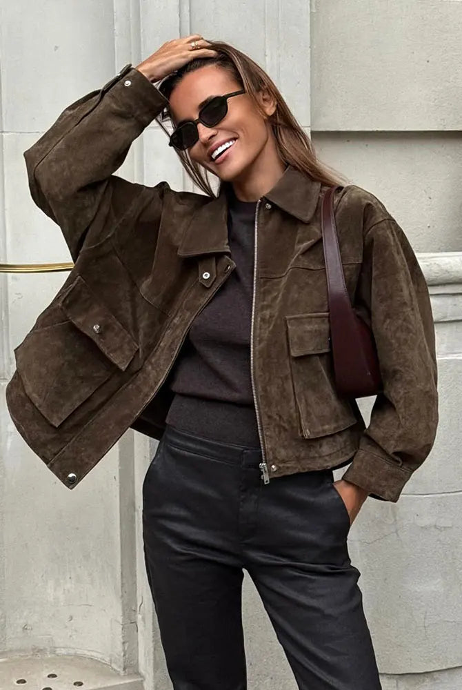 Isabella wearing Lumina Wear Rosalind suede utility jacket with flap pockets and zip front, stylish and versatile for everyday wear.
