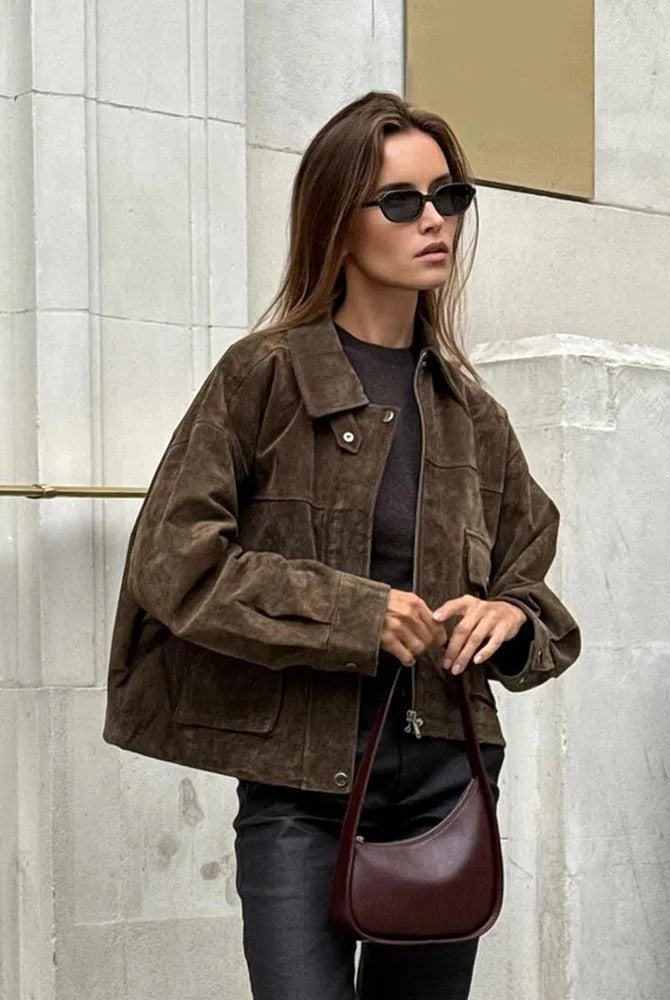 Isabella wearing Lumina Wear Rosalind suede utility jacket with flap pockets and zip front, stylish and versatile outerwear.