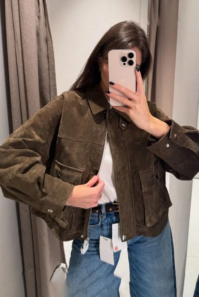 Isabella wearing Lumina Wear Rosalind suede utility jacket with flap pockets and zip front, stylish and versatile outerwear.