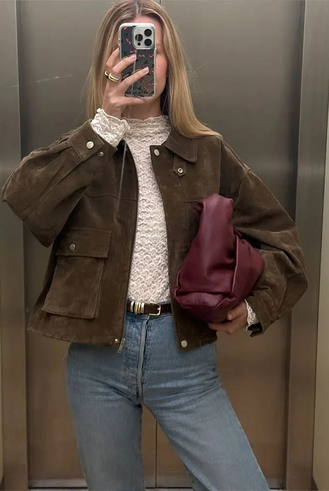 Isabella wearing Lumina Wear Rosalind suede utility jacket with flap pockets and zip front, stylish and versatile outerwear.