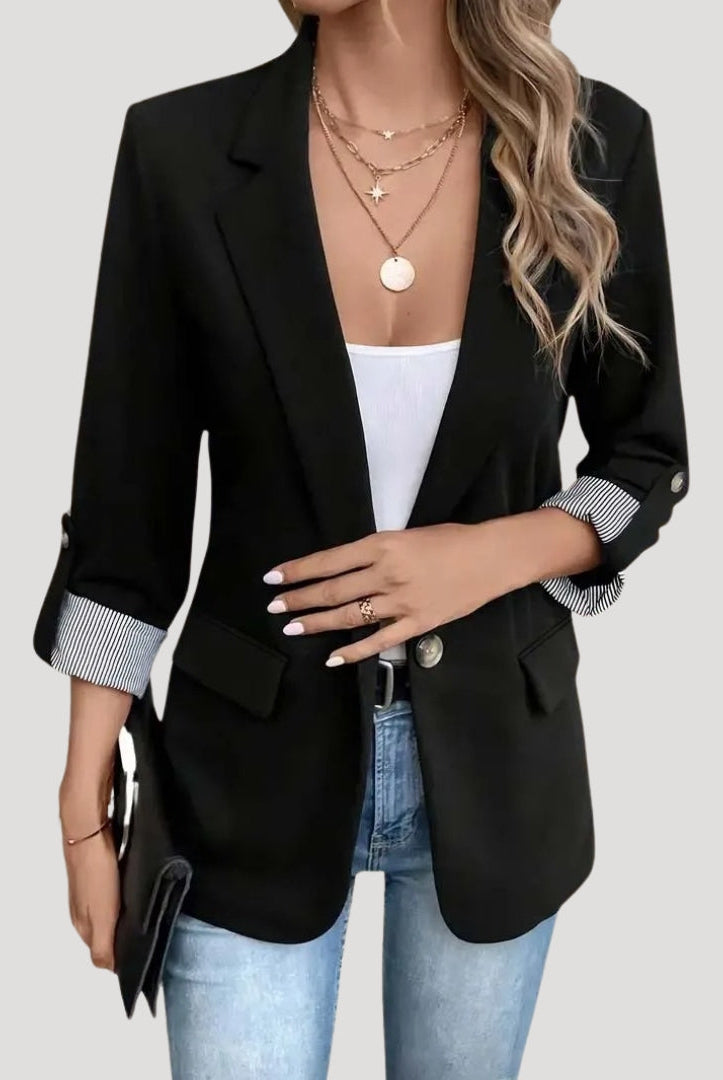 Lumina Wear Isabella tailored blazer with roll-up sleeves and flap pockets, shown on a model. Elegant, structured women’s blazer.