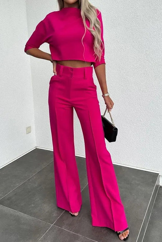 Isabella wearing Lumina Wear Camille tailored crop top and high-rise wide-leg trousers set, featuring a sleek, modern design.