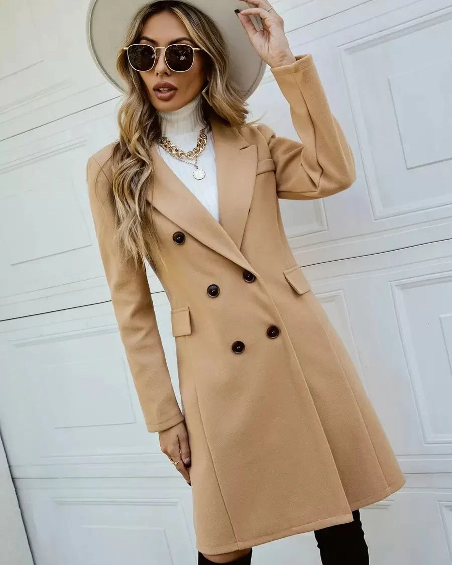 Lumina Wear Isabella tailored double-breasted knee-length overcoat shown in a stylish, fitted design with classic lapels and a sleek silhouette.