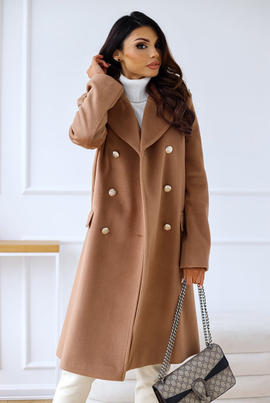 Woman wearing Lumina Wear Isabella tailored longline winter trench coat with structured shoulders, stylish and elegant winter outerwear.