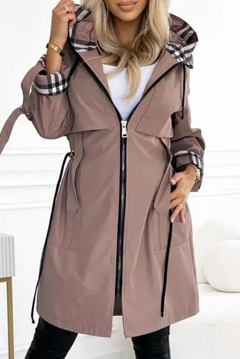 Women's waterproof Isabella parka with checked lining and drawstring waist by Lumina Wear, tailored outerwear for rainy days.