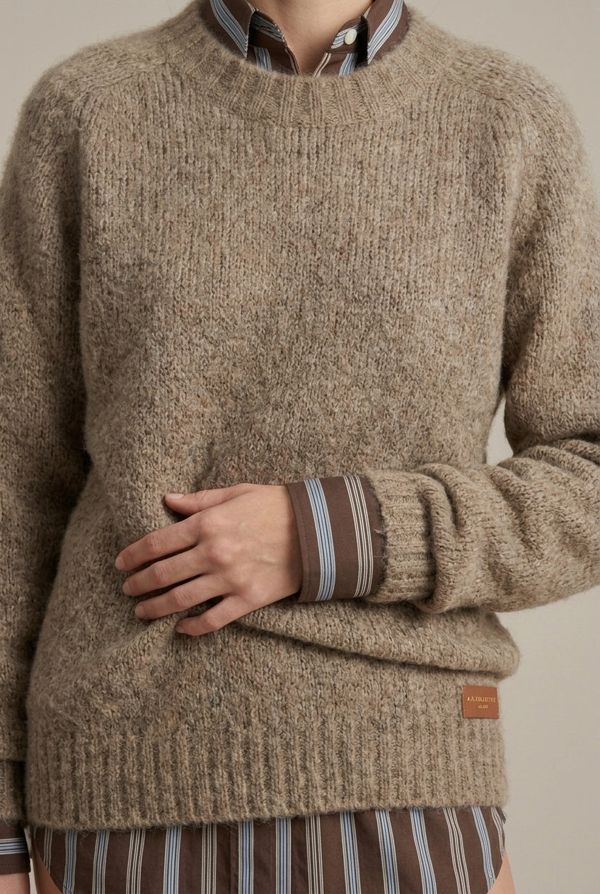 Lumina Wear Isabella textured ribbed oversized women's sweater with V-neck, cozy knit, and relaxed fit in neutral tones.