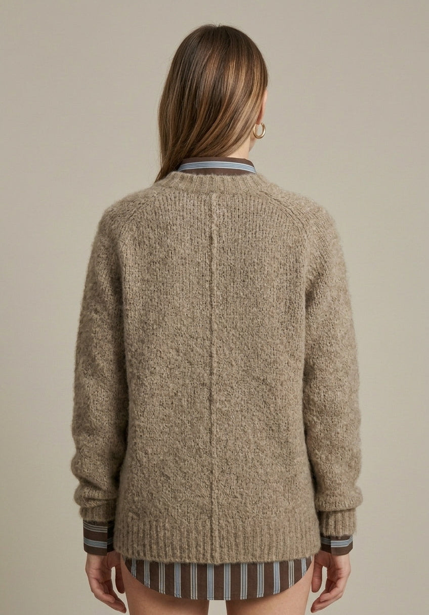 Lumina Wear Isabella textured ribbed oversized women's sweater with V-neck, soft knit fabric, and relaxed fit.
