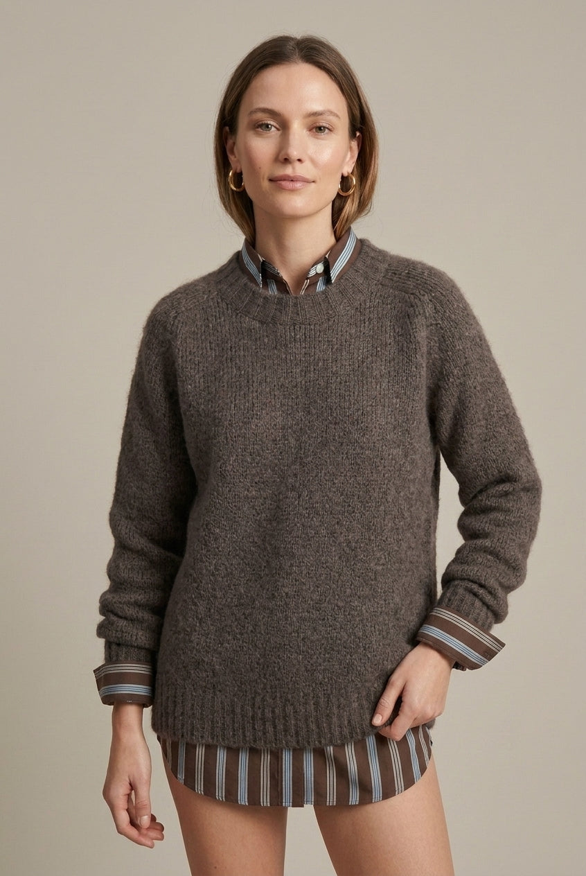 Textured ribbed oversized women's sweater with V-neck by Lumina Wear, shown in a cozy, neutral tone.