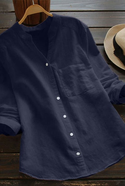 Light blue Lumina Wear Jessica relaxed fit button blouse with a timeless design, shown on a hanger against a neutral background.