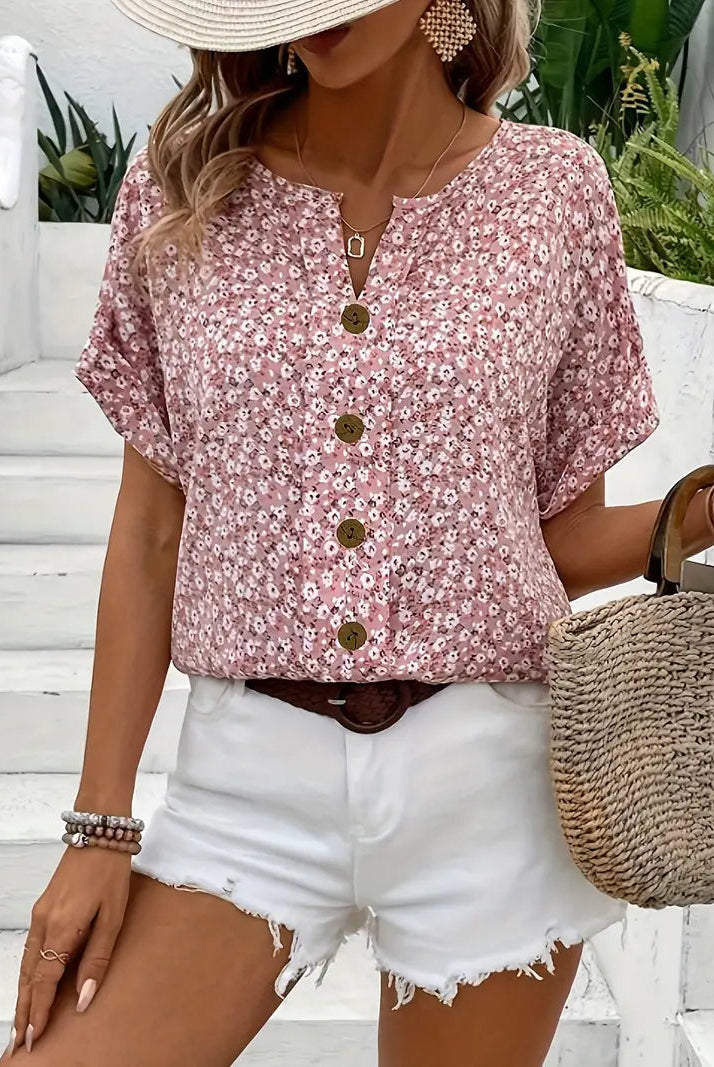 Light floral blouse from Lumina Wear featuring a relaxed fit and button front, displayed on a mannequin.