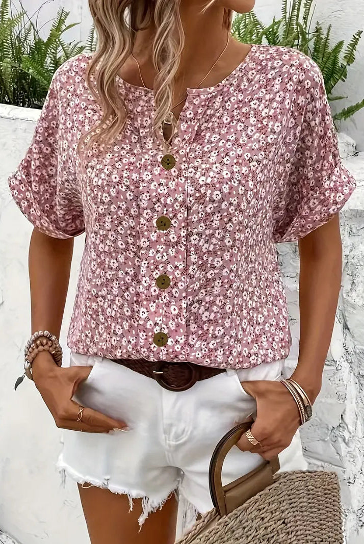 Light floral blouse from Lumina Wear featuring a relaxed fit and button front, styled with soft fabric and vibrant floral pattern.
