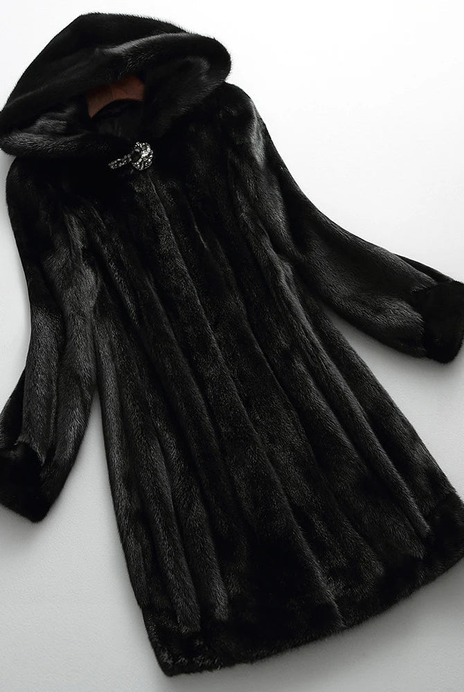 Lumina Wear Kensington elegant long faux fur winter coat with hood, stylish and warm outerwear for cold weather.