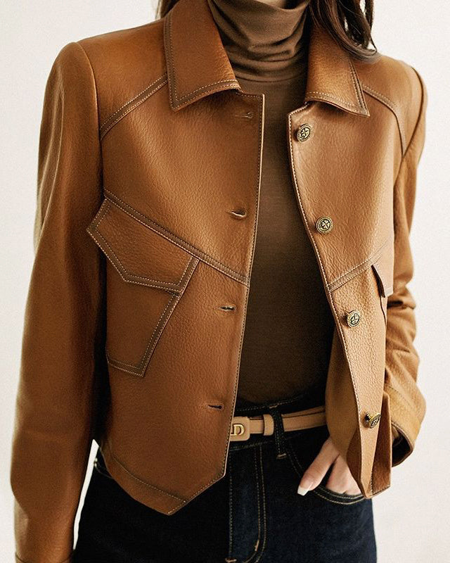 Lucille Lumina Wear cropped oversized faux leather jacket with button closure, featuring a stylish and modern design.