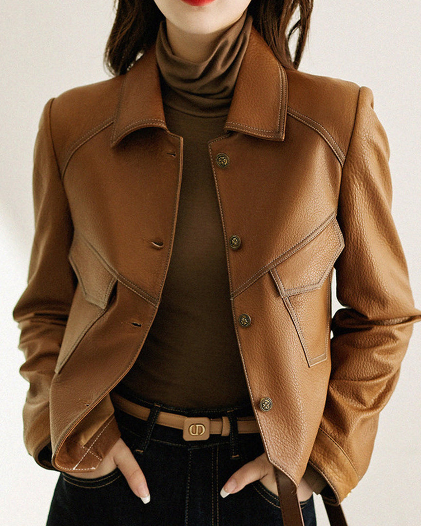 Lucille Lumina Wear cropped oversized faux leather jacket with button closure, shown on a model against a neutral background.