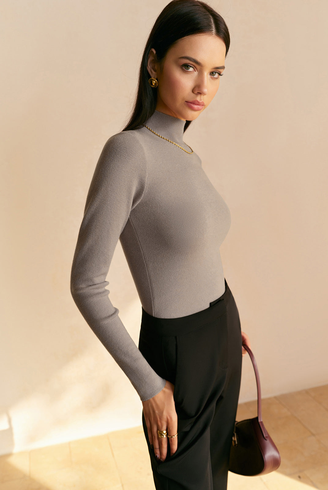 Women's top by Lumina Wear featuring an elegant mock neck and relaxed fit, shown in a stylish, comfortable design.