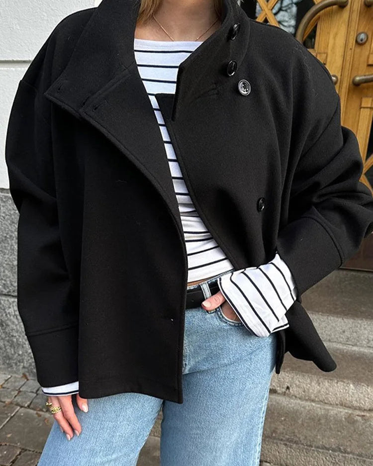 Lumina Wear Martha structured high-neck cropped jacket with button closure, shown in a stylish design featuring a fitted silhouette.